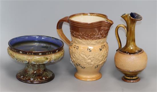 A Royal Doulton stoneware motto jug, a ewer type, a vase and a pedestal dish